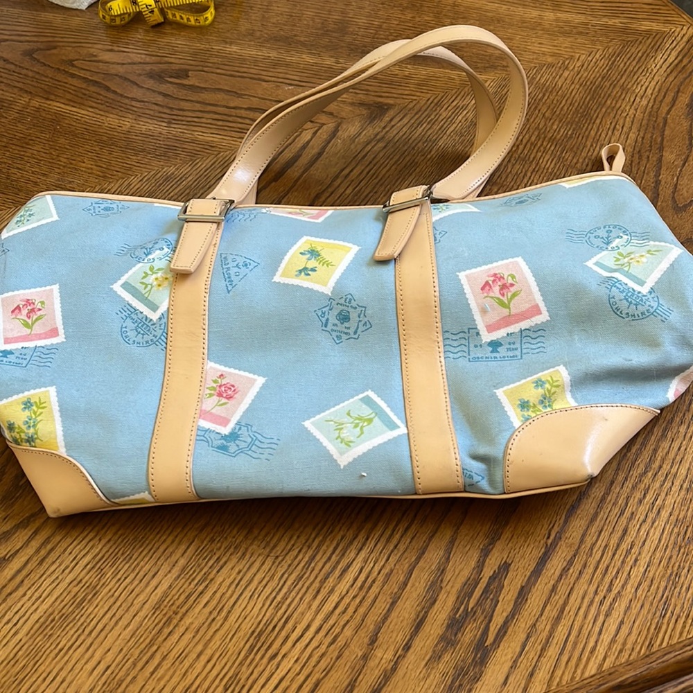 Valerie Stevens sky blue bag with floral and postage stamp like design